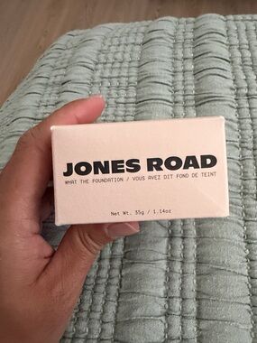 Jones Road foundation box in pale beige with black logo